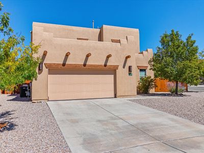 FACADE OF THE HOME WITH ATTACHED CAR GARAGE | Image 2