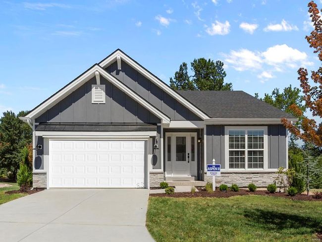 View of front of property featuring a garage and a front lawn | Image 4