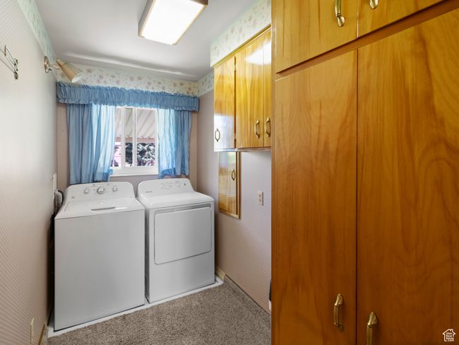 Washroom with washer and clothes dryer, custom cabinet space | Image 20