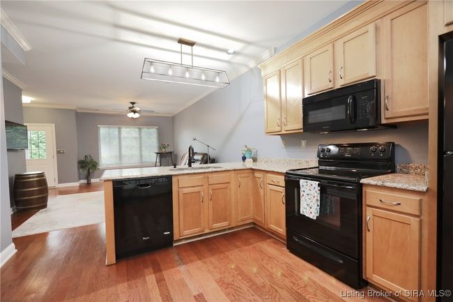 There is room for a small table & chairs in kitchen | Image 11