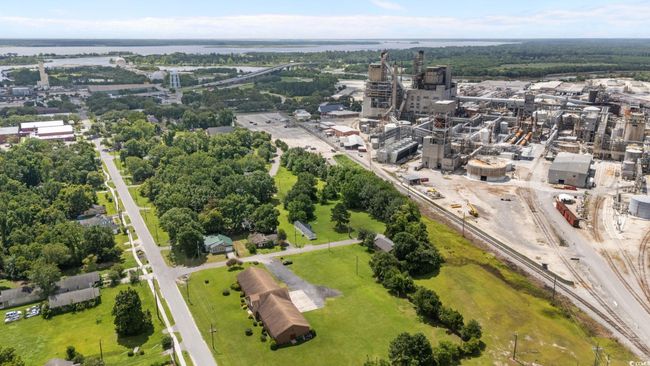 Aerial view of property and surrounding area with a large body of water | Image 13