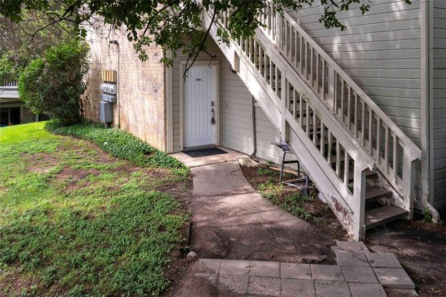 View of exterior entry with brick siding | Image 8