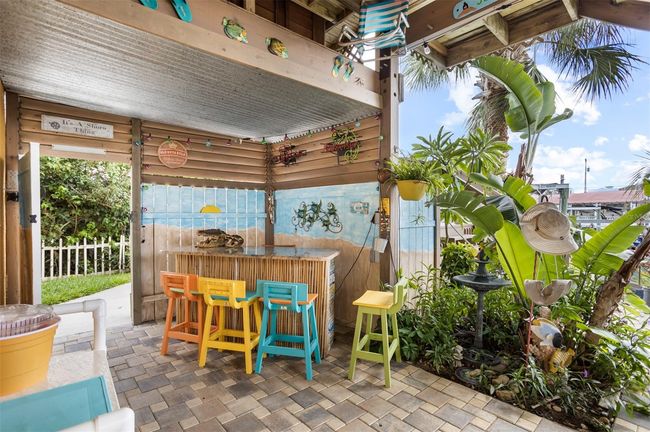 OUTSIDE PAVED PATIO WITH COVERED BAR | Image 57