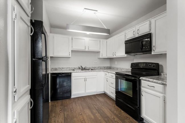 Kitchen with white cabinets remodeled 2022 | Image 8