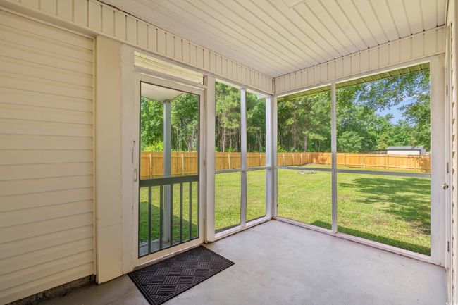 View of unfurnished sunroom | Image 26
