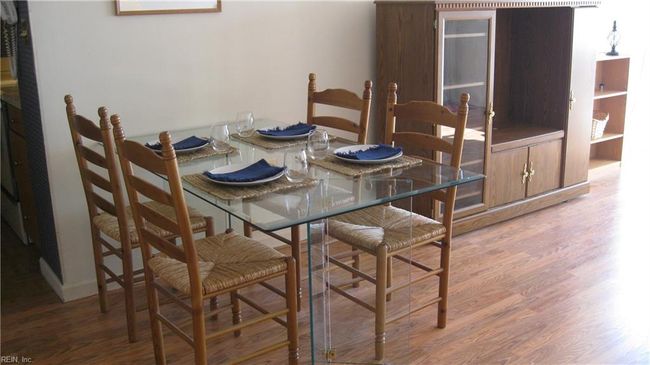 Dining area with table and chairs to convey to new owner.Laminate flooring. | Image 11