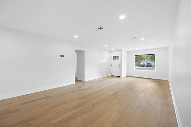 Unfurnished living room with recessed lighting and light wood-style flooring | Image 7