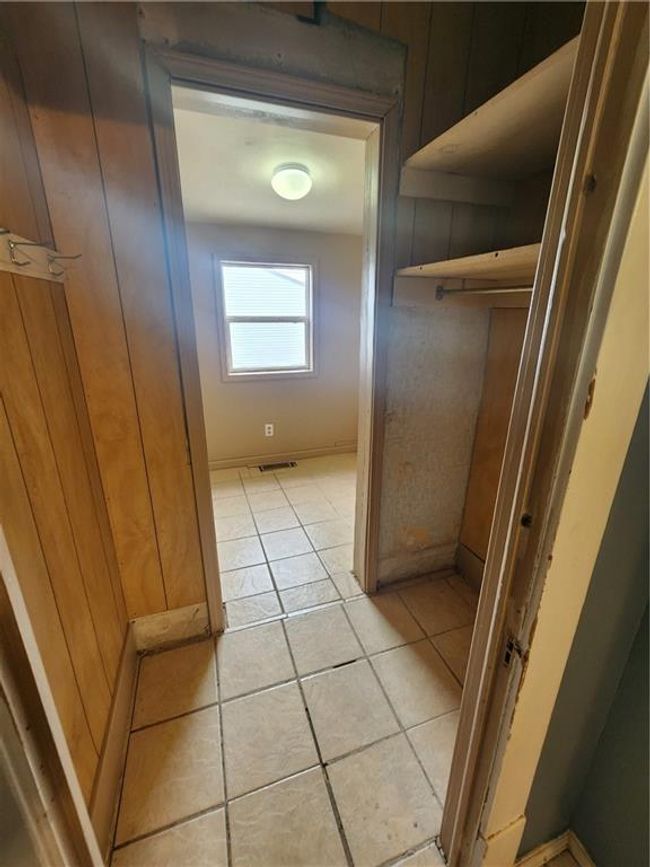 Hallway featuring visible vents and light tile patterned floors | Image 20