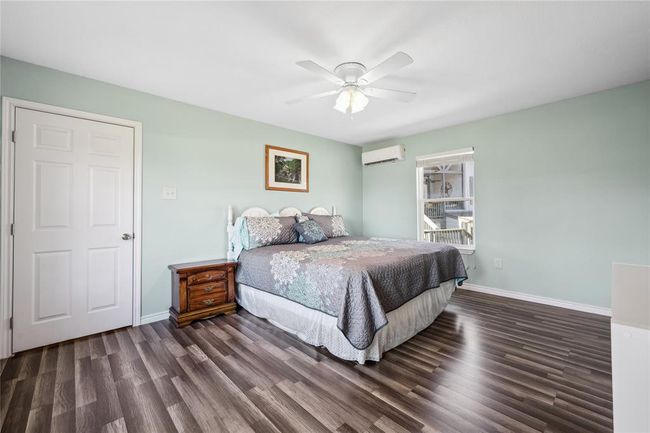 Largest of bedrooms. On rear of home with beautiful water views. Would also make a great game room or bunk room. | Image 18