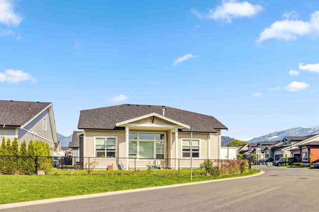 Bungalow with roof with shingles, a mountain view, a residential view, and fence private yard | Image 8