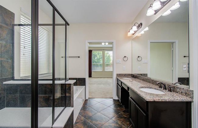 Master Bath has dual undermount sinks with granite countertops. | Image 23