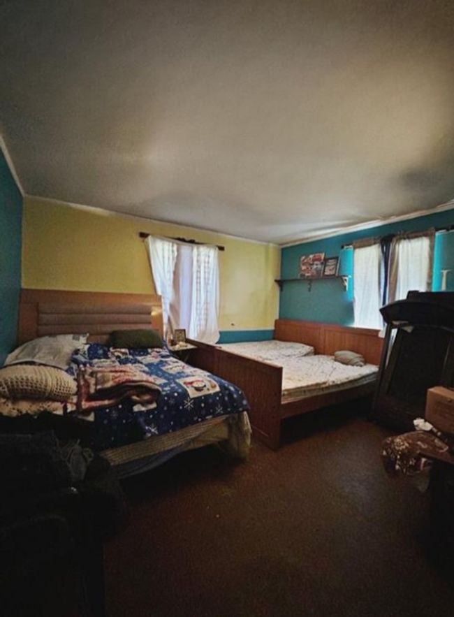 Carpeted bedroom featuring multiple windows | Image 7