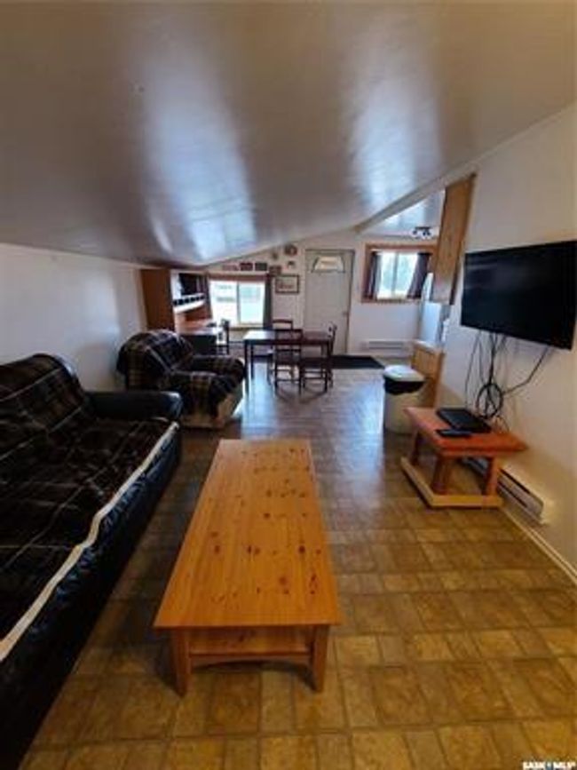 Living room featuring lofted ceiling | Image 36