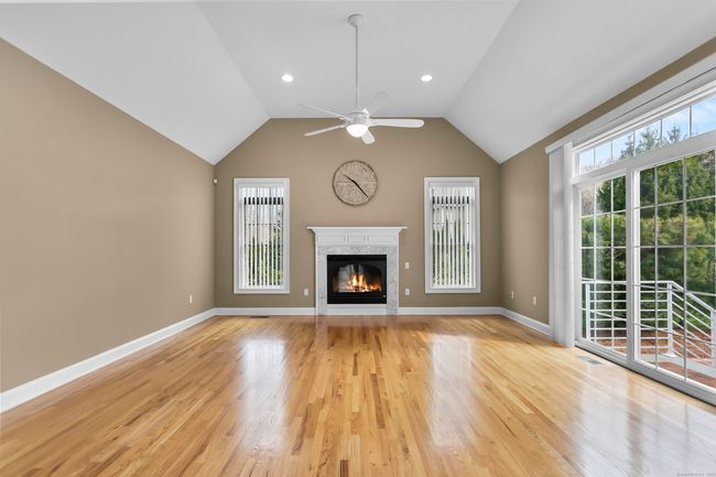Family room with gas fireplace and vaulted ceilings | Image 14