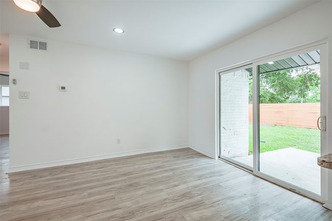 Unfurnished room featuring light wood-type flooring, a ceiling fan, and recessed lighting | Image 9