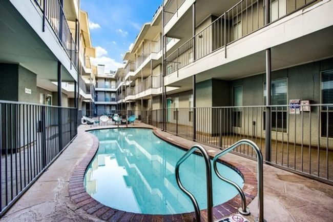Community pool featuring fence | Image 10