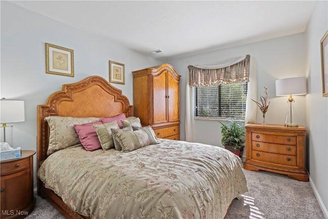 Bedroom with carpet flooring | Image 21