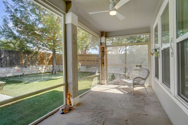 Screened in patio leads to back yard, wonderful on cooler days to enjoy morning coffee or afternoon tea | Image 11