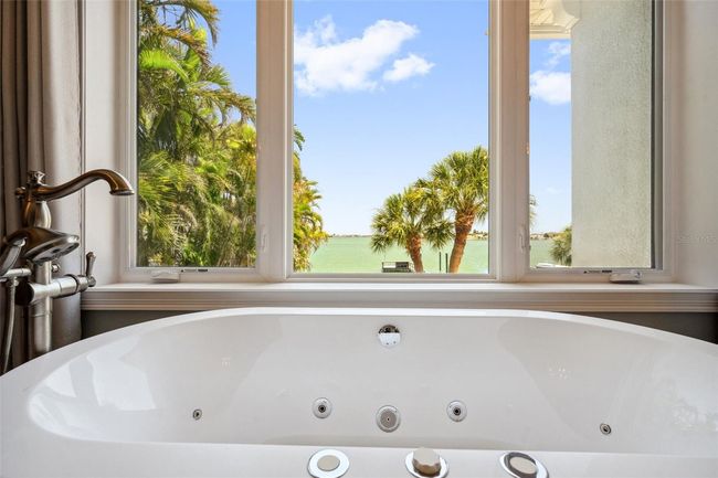 Enjoy a dreamy water view whilst soaking in your jetted tub. | Image 50