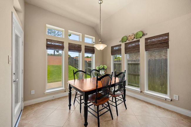 Charming breakfast room, leading to the covered back patio. | Image 16