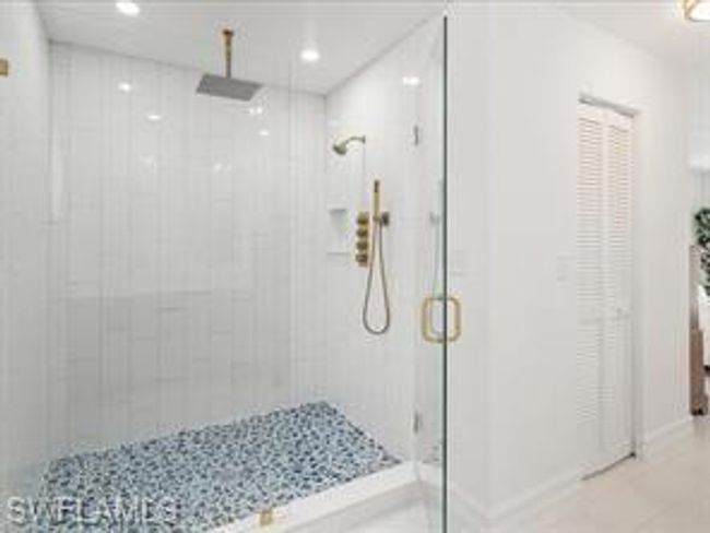 Bathroom with walk in shower and tile flooring | Image 15