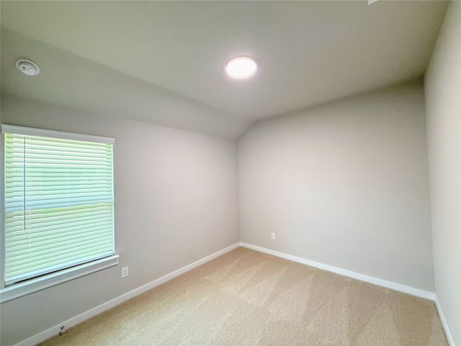 Unfurnished room with light carpet and lofted ceiling | Image 20