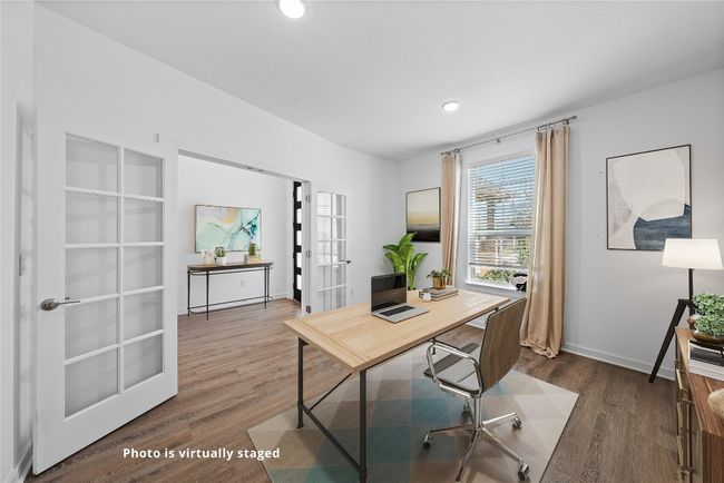 Office featuring baseboards, wood finished floors, and french doors | Image 7
