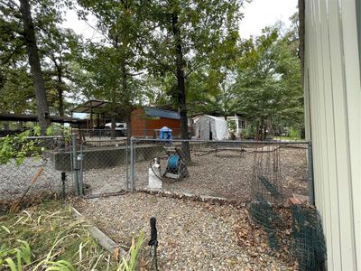 View of yard with a storage unit | Image 3