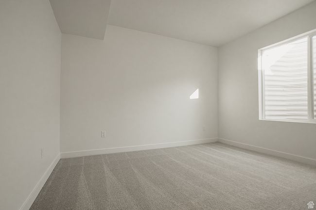 Carpeted empty room featuring baseboards | Image 45