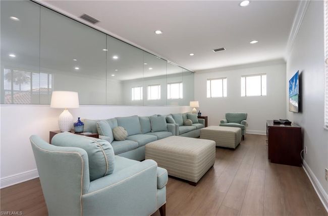 Living room with ornamental molding, wood finished floors, and recessed lighting | Image 14