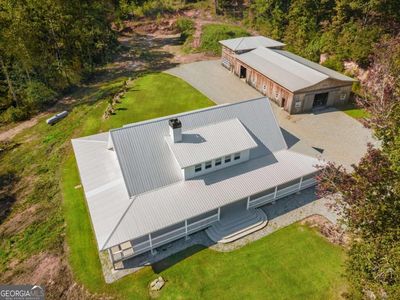 View of the home and shop with both sets of double doors open | Image 1