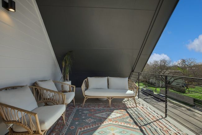 Third-floor balcony featuring an outdoor hangout area | Image 38