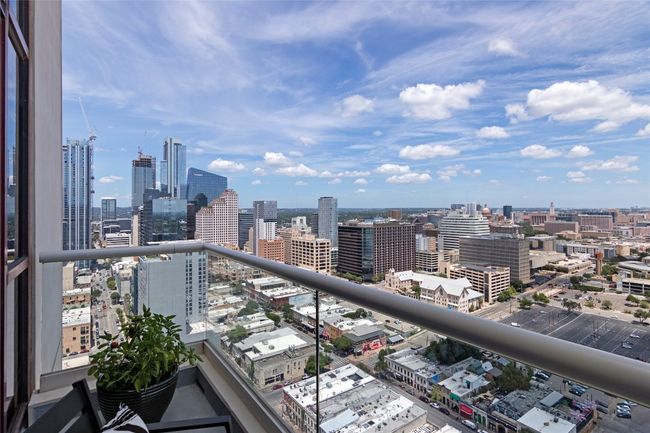 The balcony further enhances the experience, offering a perfect spot to enjoy the sunset or watch the city lights come alive at night. | Image 13