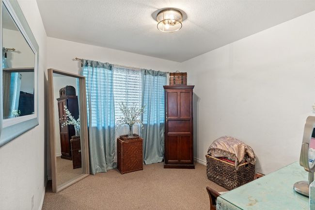 Office featuring light carpet | Image 24