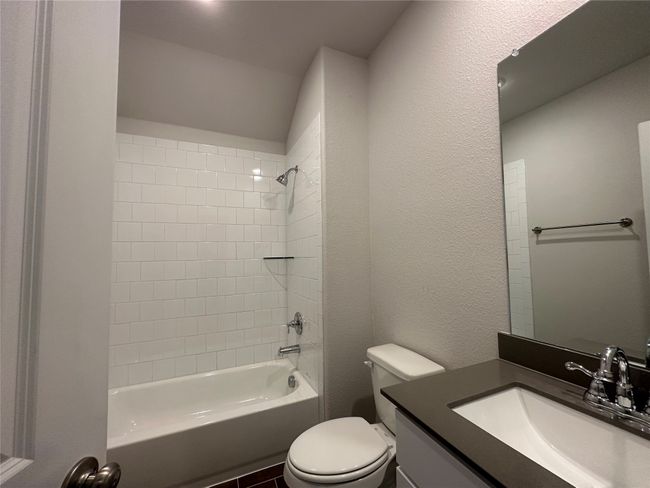 Bathroom with vanity and bathing tub / shower combination | Image 8