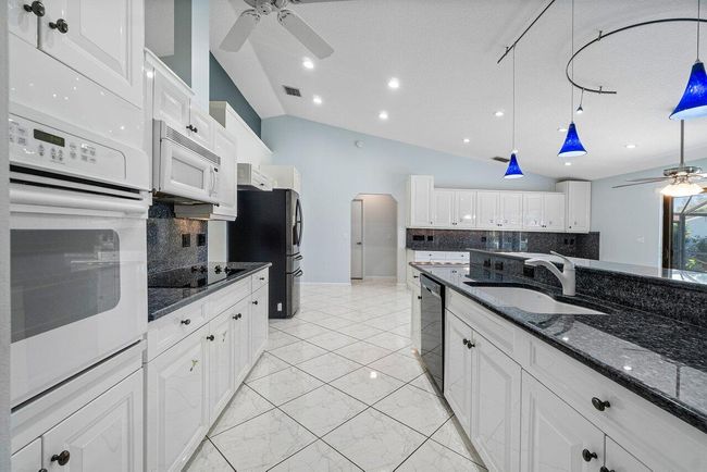 61 W Rubber Tree Dr, House other with 3 bedrooms, 2 bathrooms and null parking in Lake Worth FL | Image 13