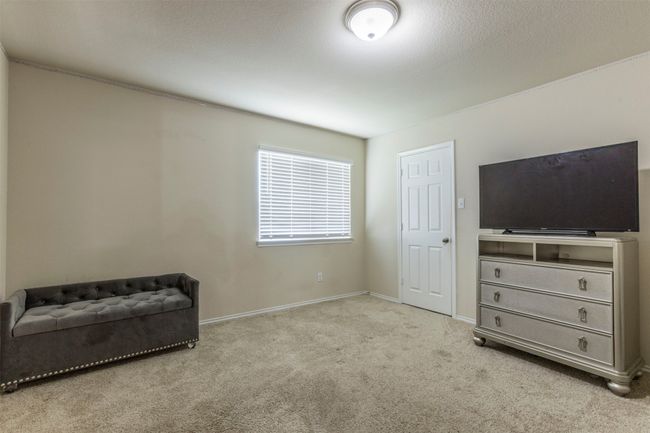Living area featuring baseboards and carpet | Image 30