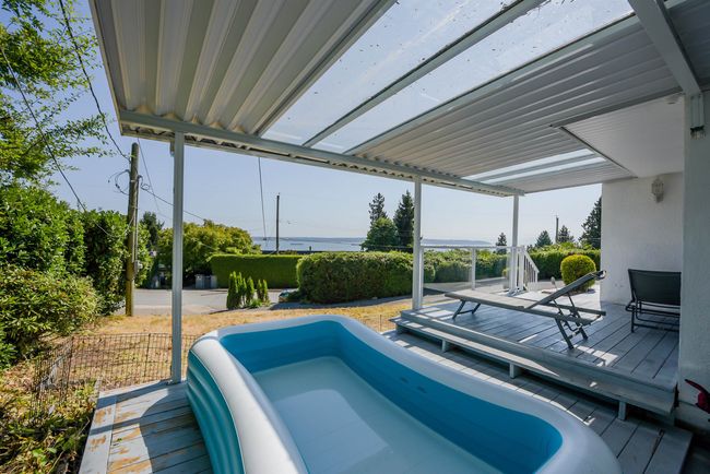 View of pool featuring a wooden deck | Image 32
