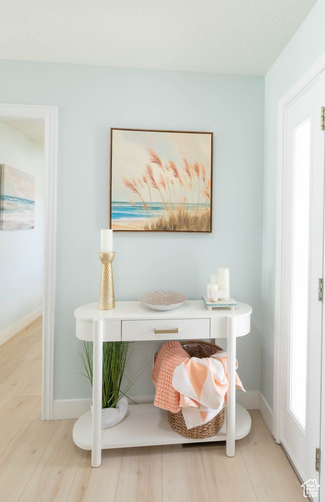 Detailed view of baseboards and wood finished floors | Image 11