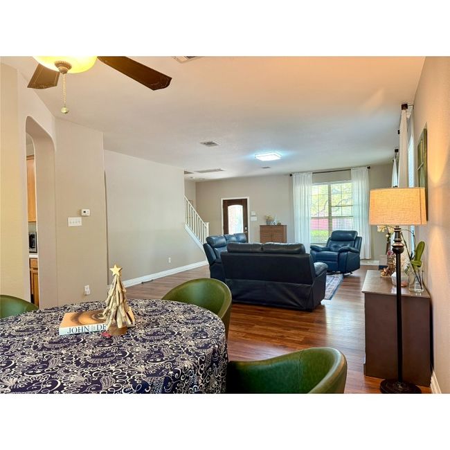 Formal dining room blends in with the family room | Image 11
