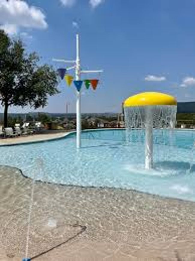 Community pool with a water play area | Image 36