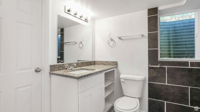 Bathroom with toilet, walk-in shower and toilet. | Image 16