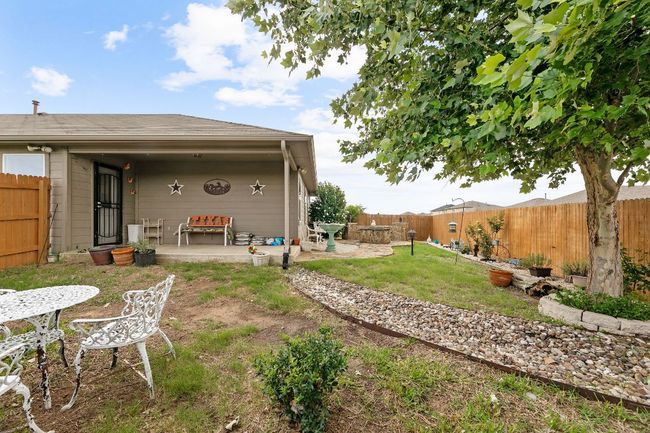 View of yard featuring a patio and a fenced backyard | Image 17