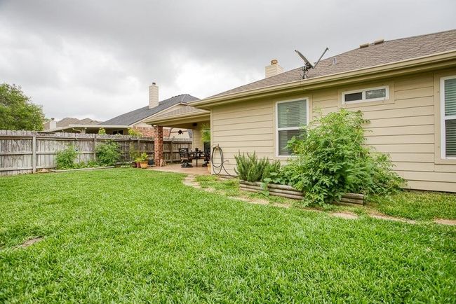 Back yard boasts vegetable garden and garden shed | Image 32
