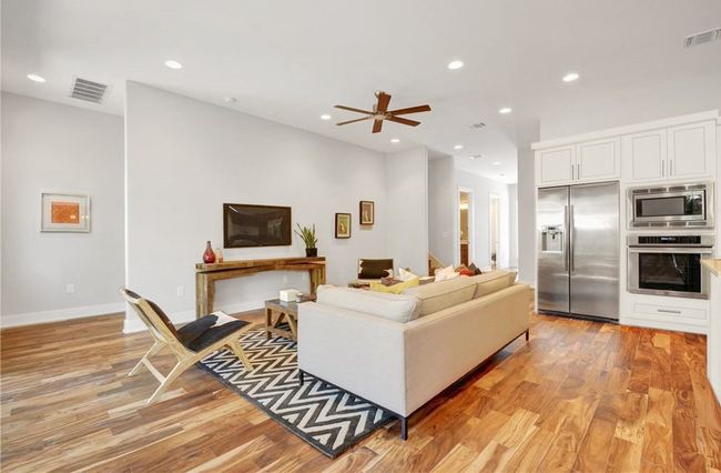 Living area with visible vents, recessed lighting, light wood finished floors, and a ceiling fan | Image 5