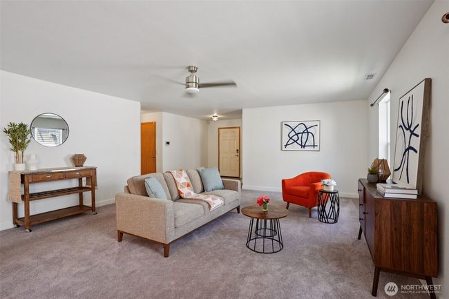 Looking from the dining room to the entry and garage to the left. Office/3rd bedroom is to the right | Image 8