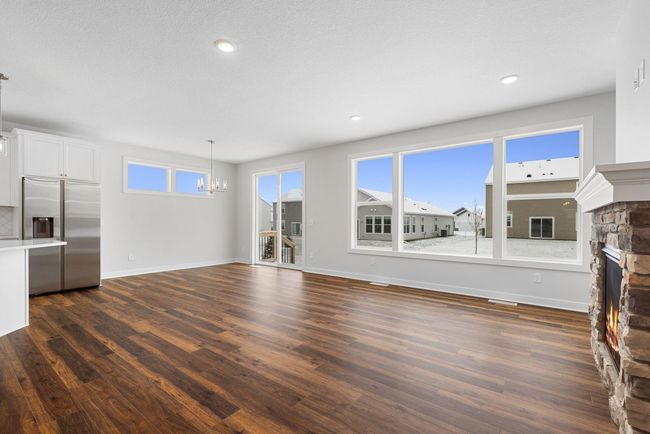 This stunning home is flooded with natural light throughout the entire main floor, creating a bright and inviting atmosphere. Large windows and an open layout enhance the sense of space, making it perfect for entertaining or relaxing. | Image 12
