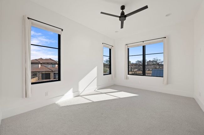 Unfurnished room with ceiling fan, carpet, and baseboards | Image 27