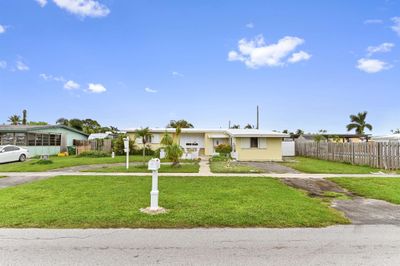 345 Davis Road, House other with 4 bedrooms, 2 bathrooms and null parking in Palm Springs FL | Image 1