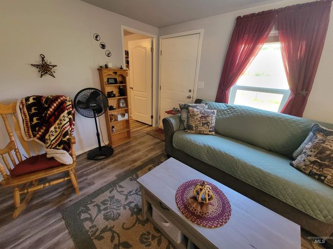 Living room featuring wood finished floors | Image 40